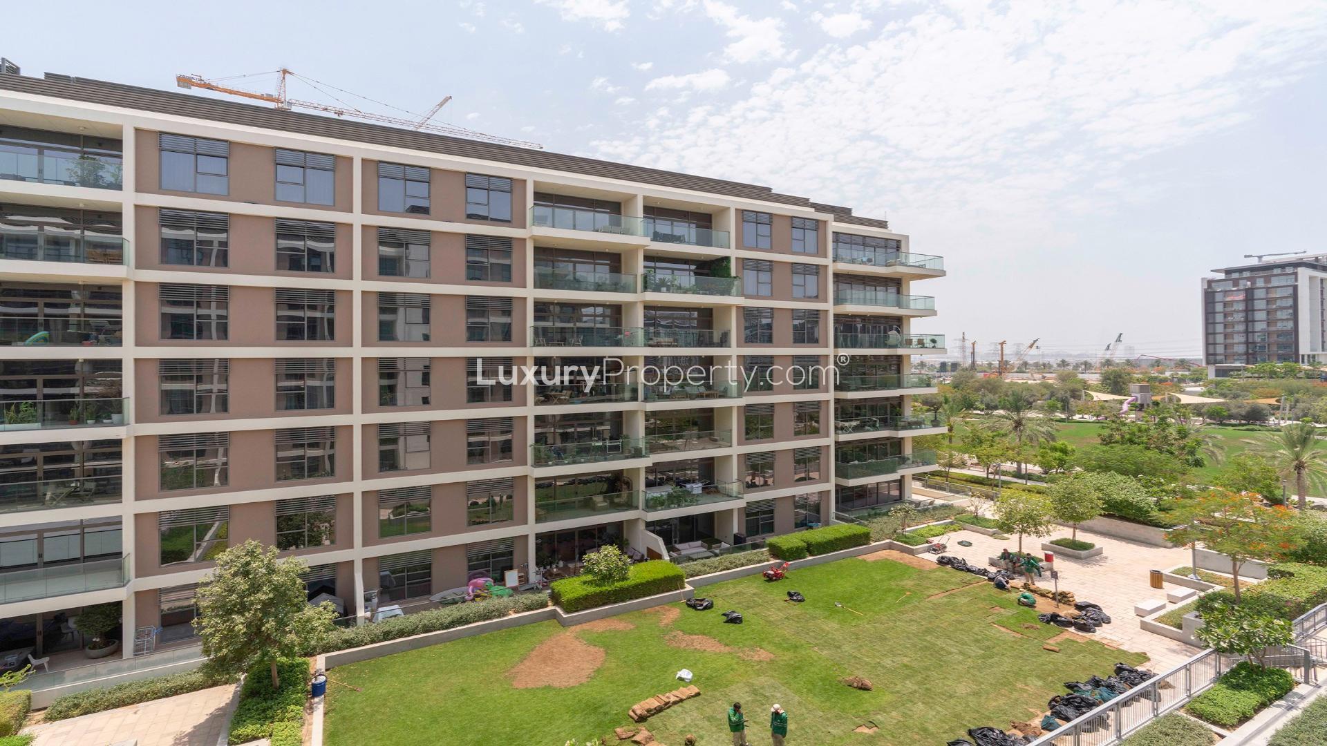 Modern kitchen with wooden cabinets in Dubai Hills Estate apartment, Park Heights