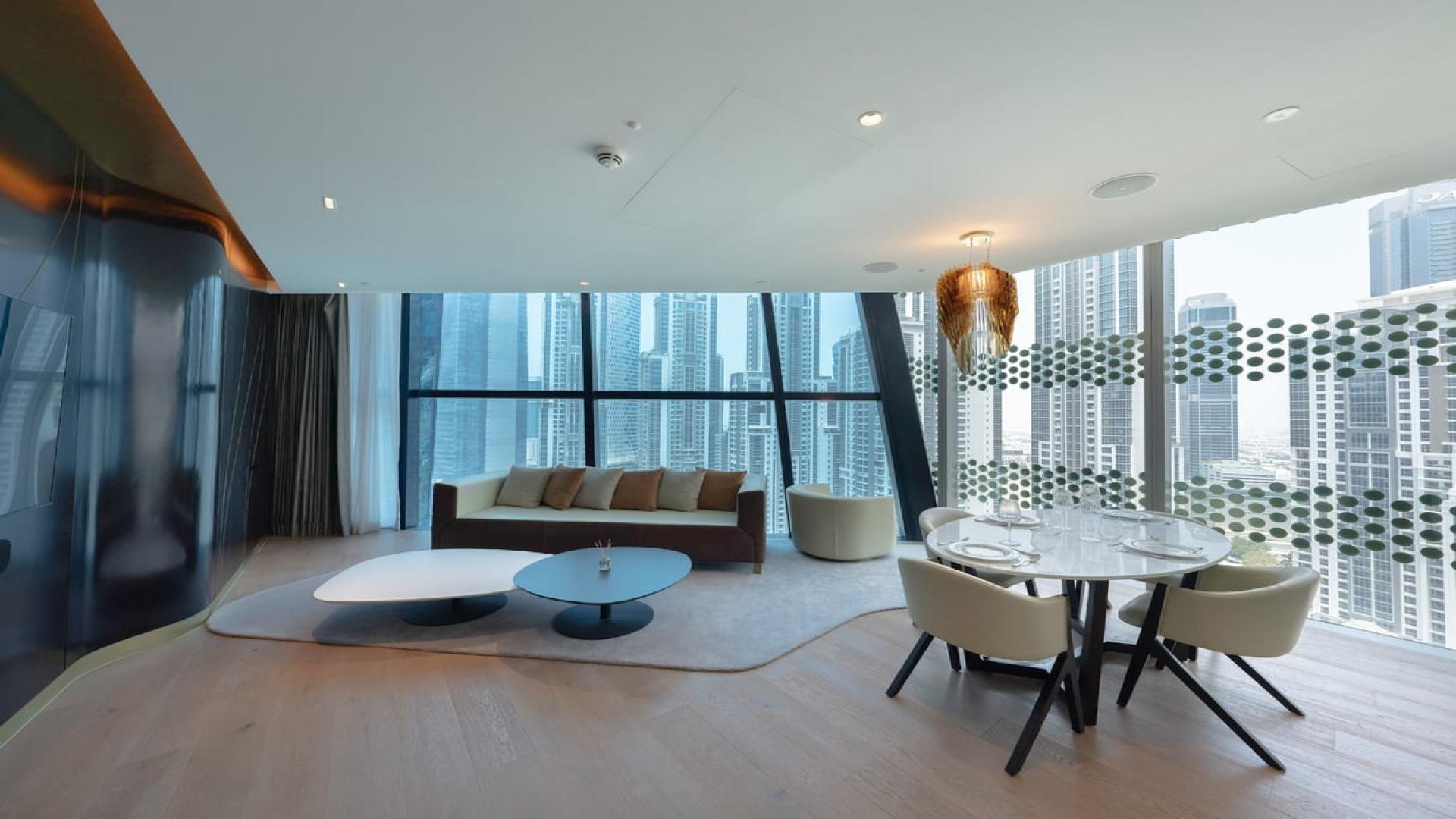 Contemporary furnished apartment interior with city view in The Opus, Business Bay, Dubai