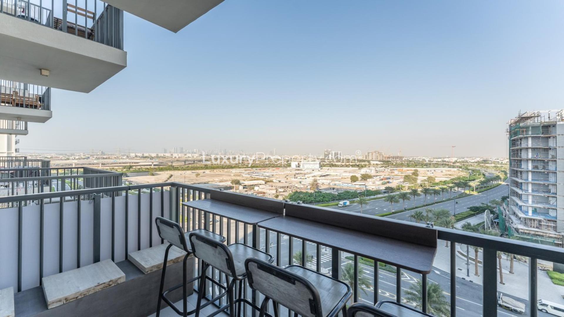 Upgraded living room in 2-bedroom apartment, Park Ridge, Dubai Hills Estate, modern decor, spacious balcony
