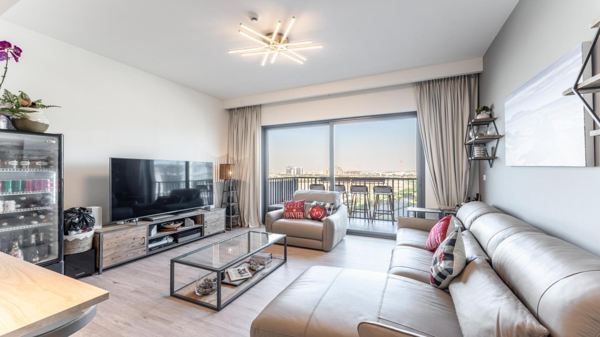 Living room of upgraded 2-bedroom apartment in Park Ridge, Dubai Hills Estate, modern decor