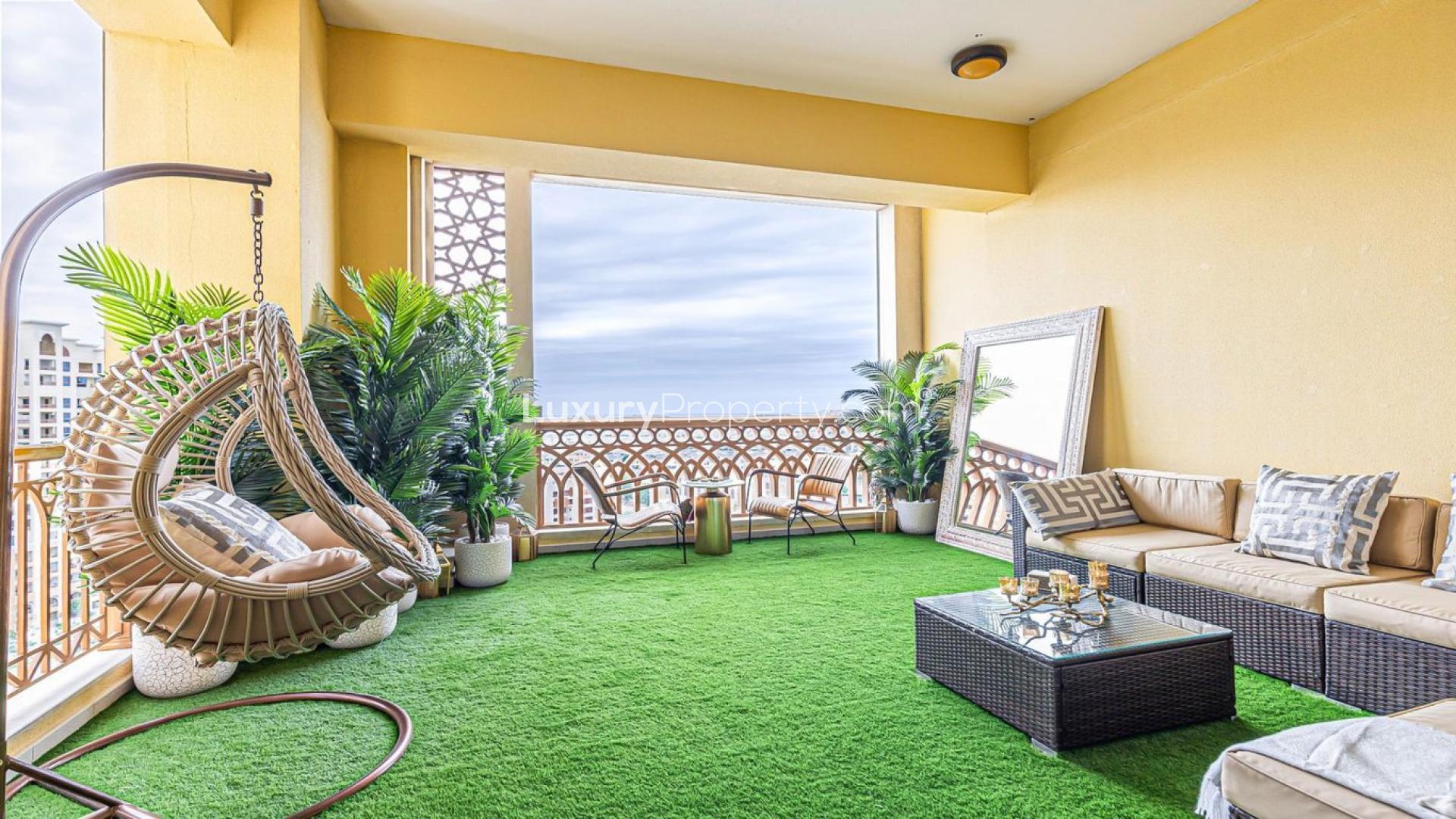 Luxurious bedroom in high-floor Palm Jumeirah apartment, featuring modern decor and balcony view