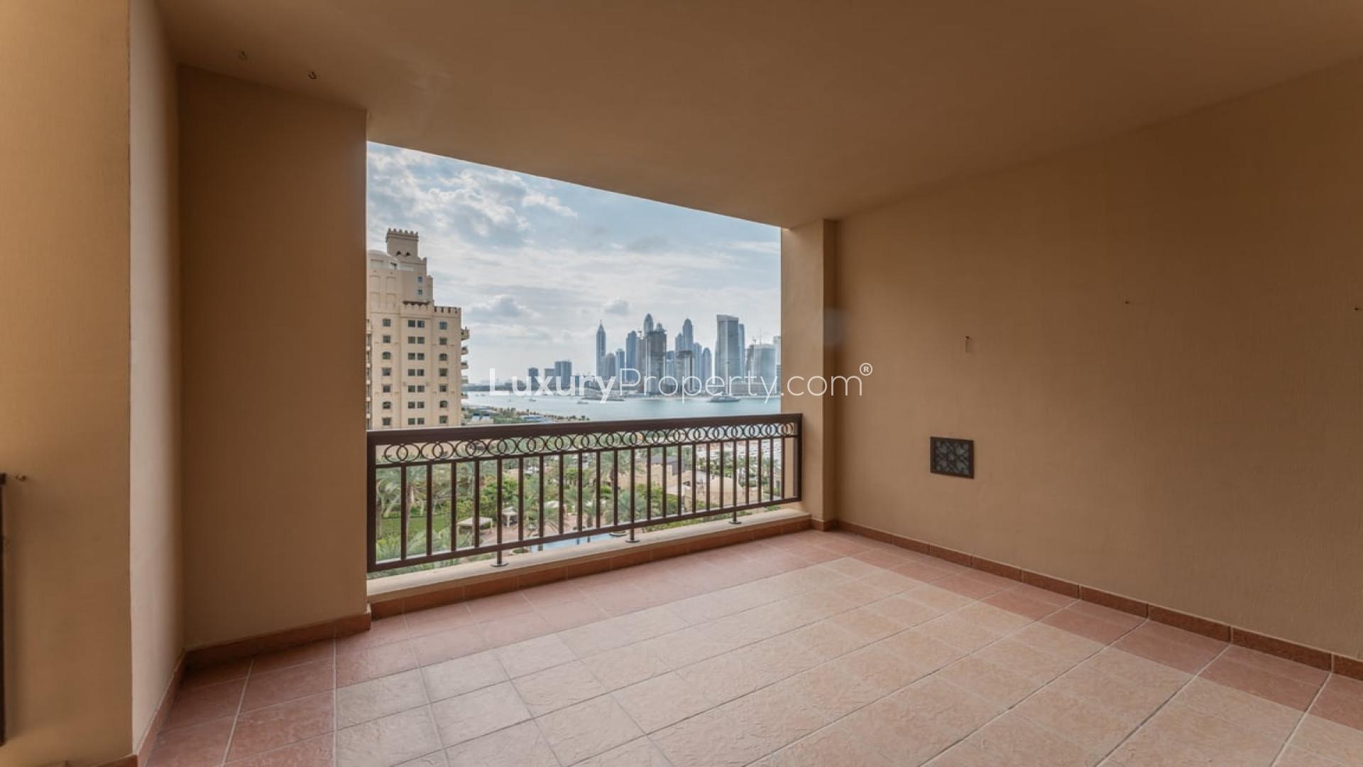 "Stunning view from The Fairmont Palm Residences apartment overlooking skyline and pool area.",Spacious balcony view from 2-bedroom apartment at The Fairmont Palm Residences, Palm Jumeirah