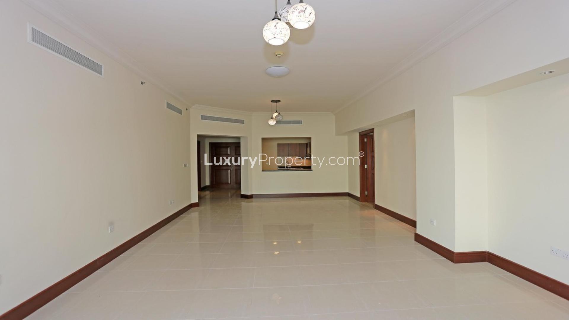Elegant apartment building in Golden Mile, Palm Jumeirah, with lush greenery and scenic views