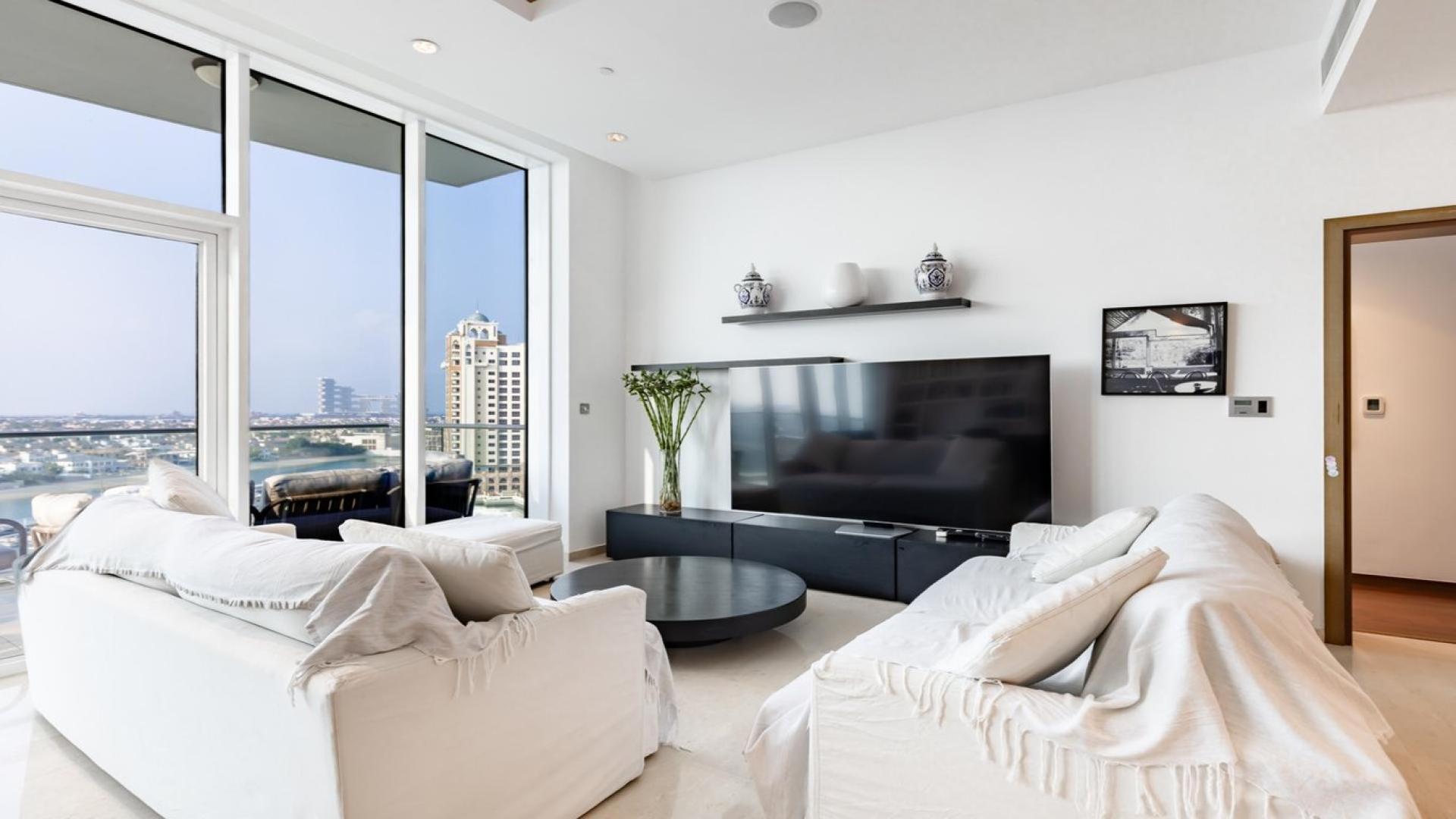 "Stunning balcony view from Oceana Residences apartment, Palm Jumeirah overlooking marina and skyline.",Modern living room with large windows in Oceana Residences, Palm Jumeirah apartment for sale