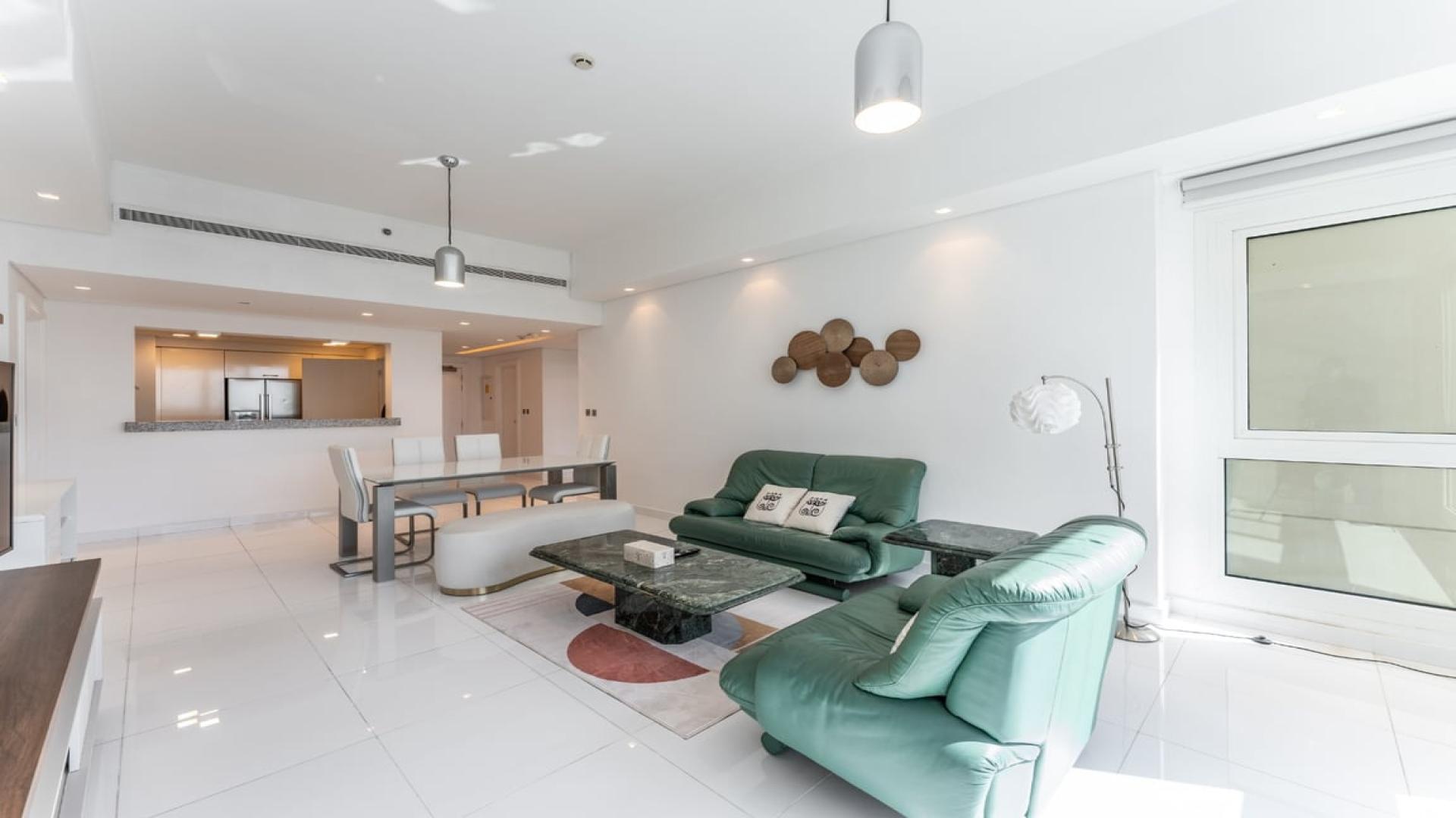 "Scenic view from 2-bedroom apartment in Marina Residences, Palm Jumeirah, showcasing cityscape.",Modern living room in 2-bedroom apartment, Marina Residences, Palm Jumeirah, for sale