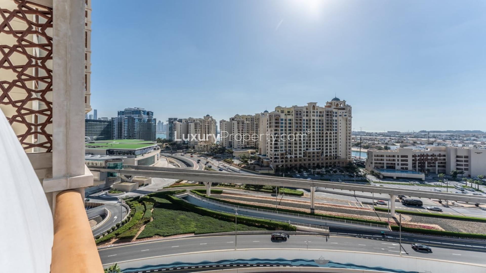 Modern living room in Marina Residences apartment, Palm Jumeirah, with large windows and stylish decor
