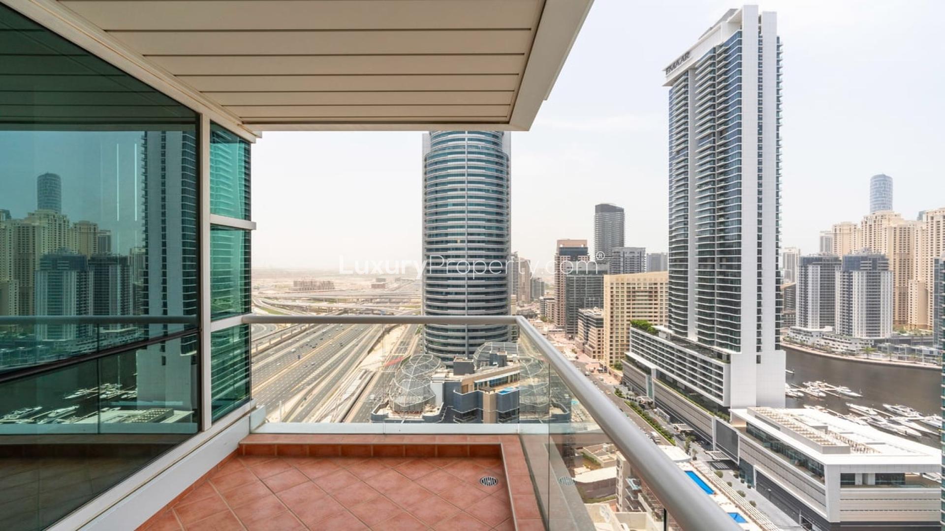 Bright living area with large windows in Dubai Marina apartment, La Riviera