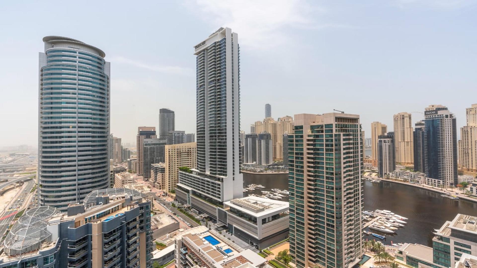 Spacious apartment interior with large windows in La Riviera, Dubai Marina, for sale