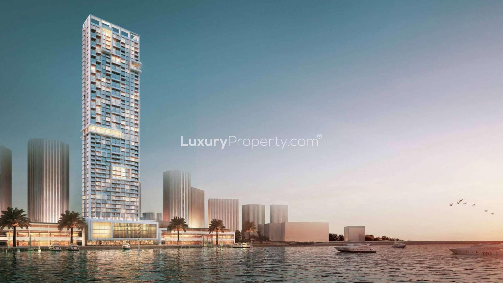 Luxurious penthouse building in Anwa, Dubai Maritime City, with waterfront views at sunset