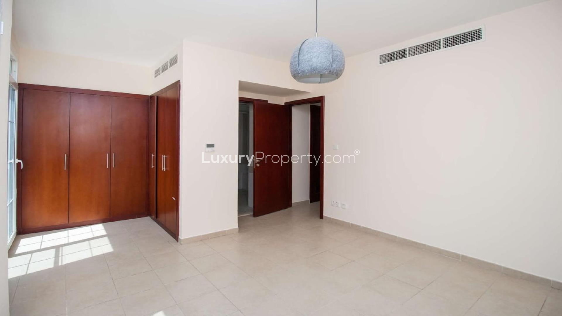 Modern bathroom in Arabian Ranches townhouse, featuring marble countertop and bathtub