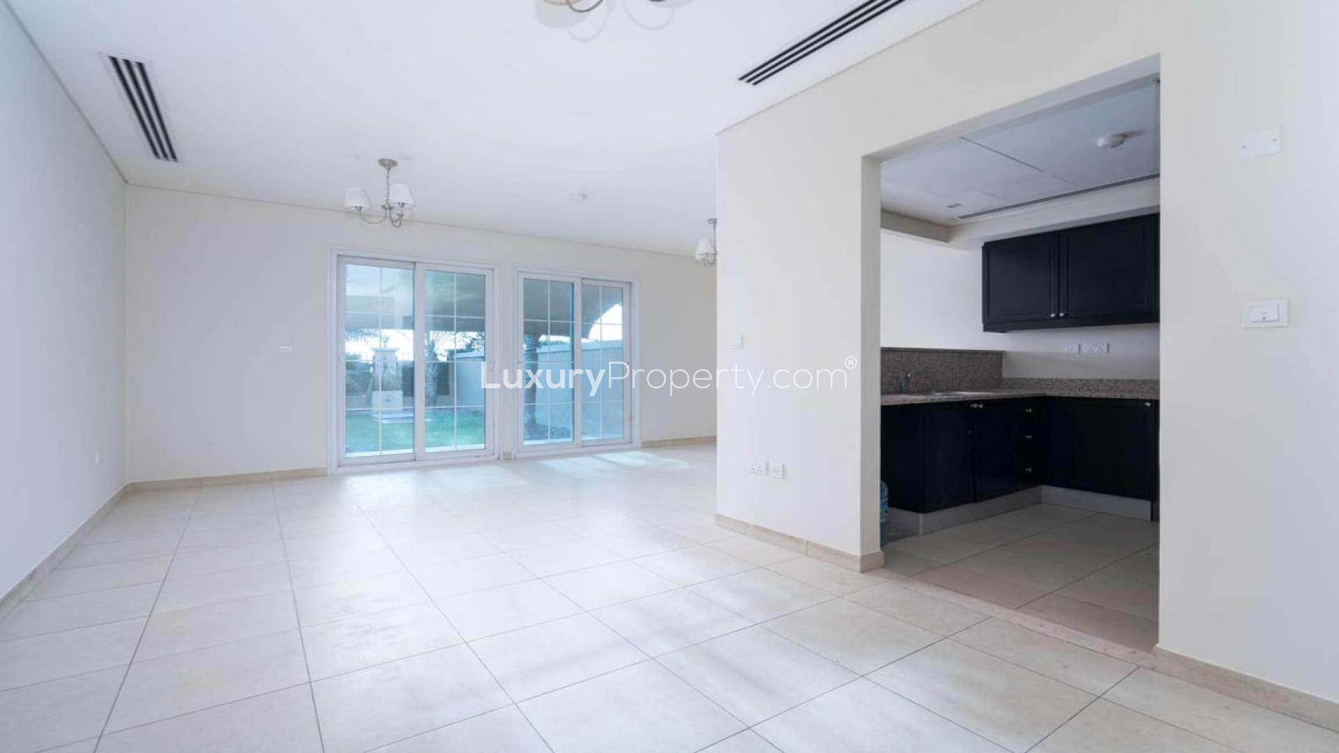 Spacious living area with garden view in Jumeirah Village Circle townhouse, Dubai