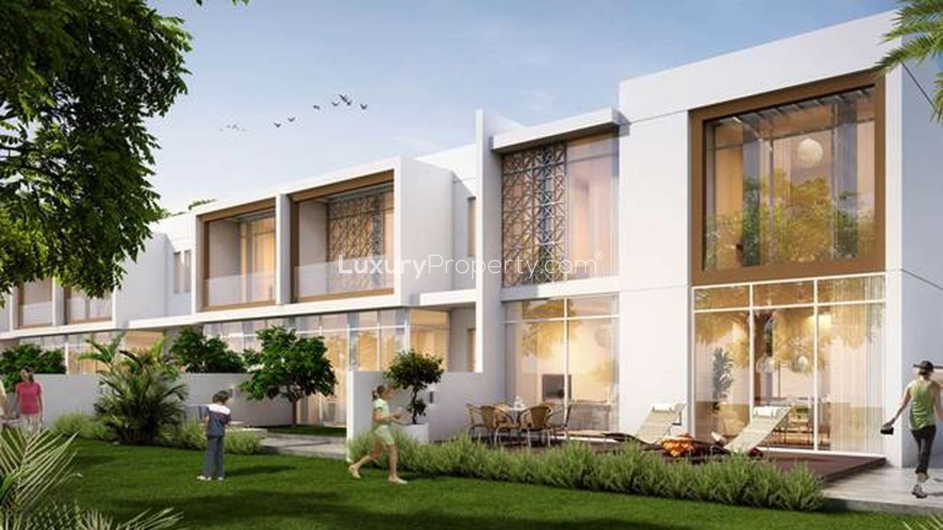 Two-bedroom townhouse exterior in Arabella II, Mudon, featuring modern design and lush landscaping