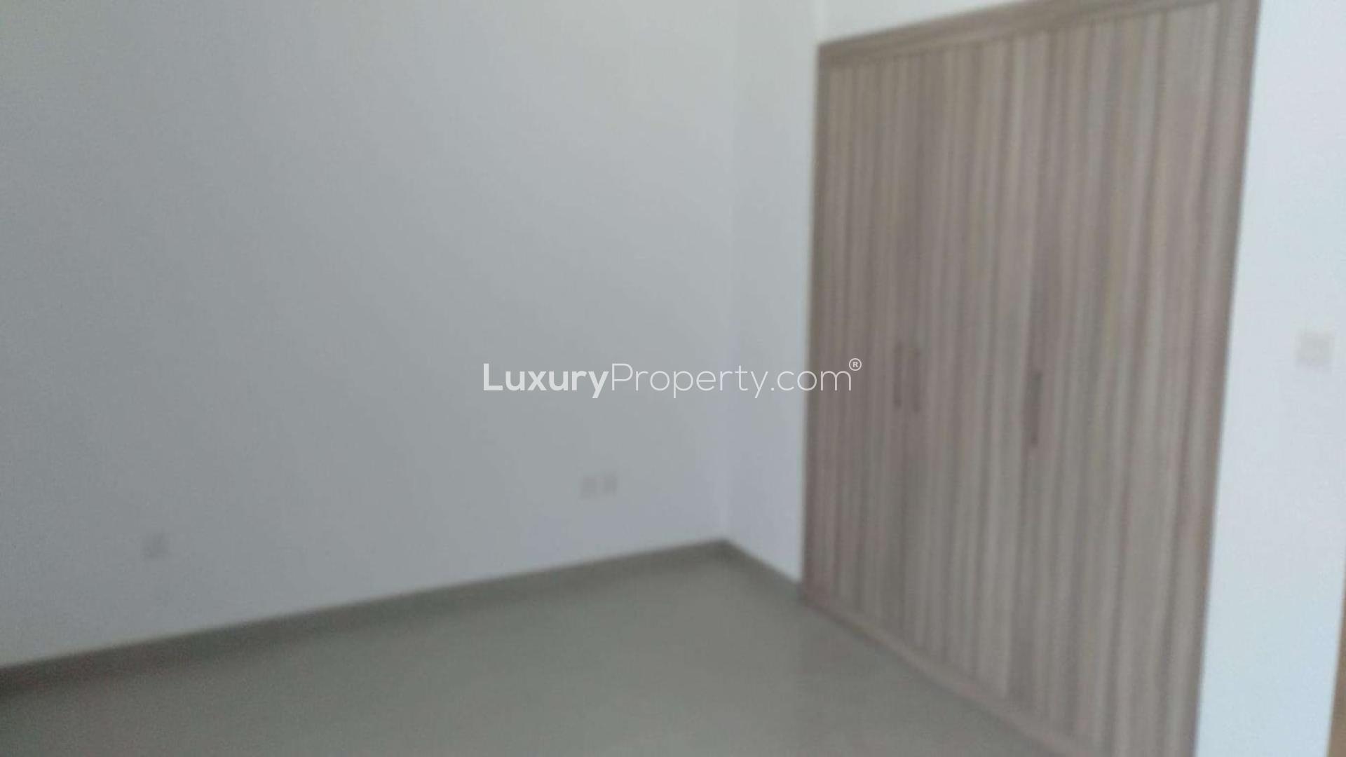 Cosy two-bedroom townhouse exterior in Arabella Townhouses, Mudon, for sale