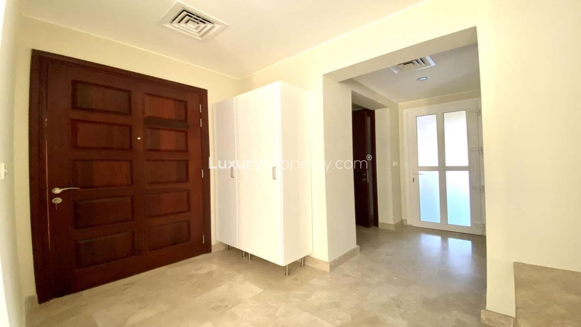 "Spacious living area in upgraded 2-bedroom townhouse, Palmera, Arabian Ranches, for sale.","Spacious entrance hallway in upgraded Vastu-compliant townhouse, Arabian Ranches, Palmera community.",Upgraded 2-bedroom townhouse in Palmera, Arabian Ranches, with spacious patio and garden view