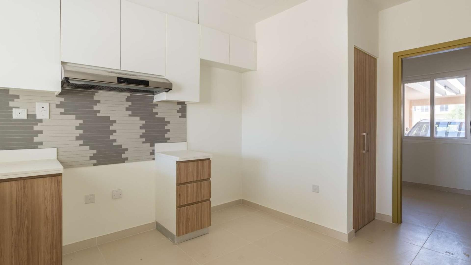 Interior of modern townhouse for sale in Villanova, Dubai Land; features open layout