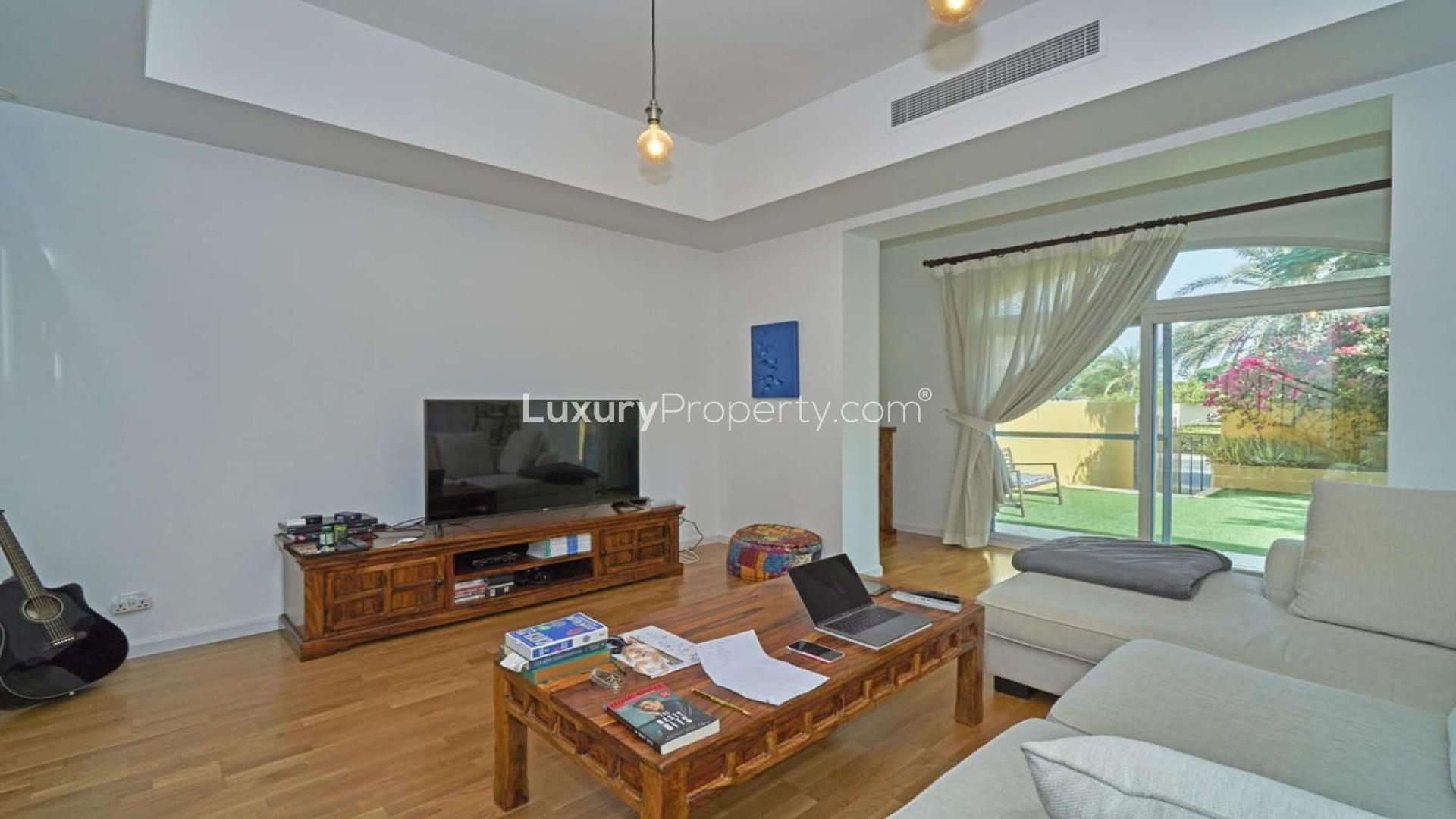 Living room with garden view in 2-bedroom villa, Palmera, Arabian Ranches