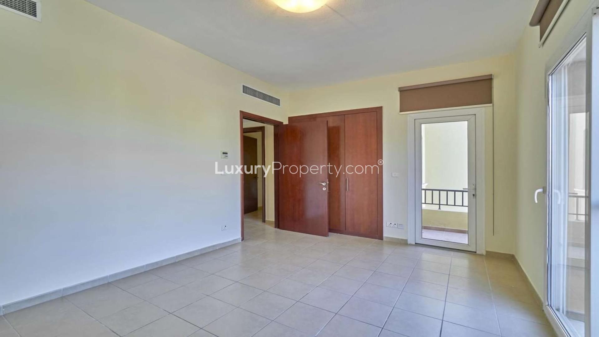 Empty room with tiled floor and balcony view in Palmera villa, Arabian Ranches