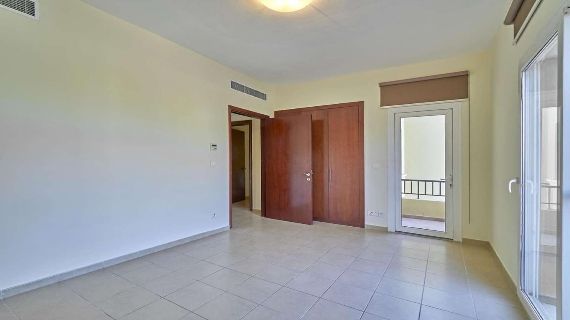 Empty room with tiled floor and balcony view in Palmera villa, Arabian Ranches