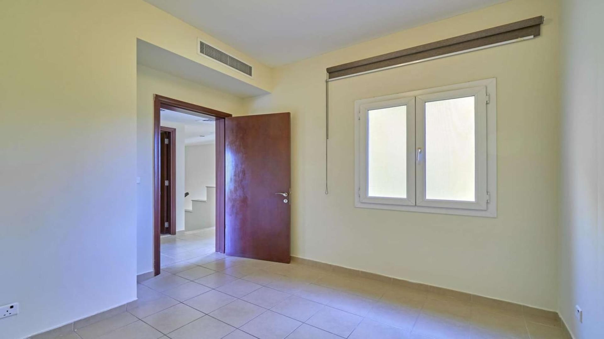 Charming two-bedroom villa exterior with garden in Palmera, Arabian Ranches for rent