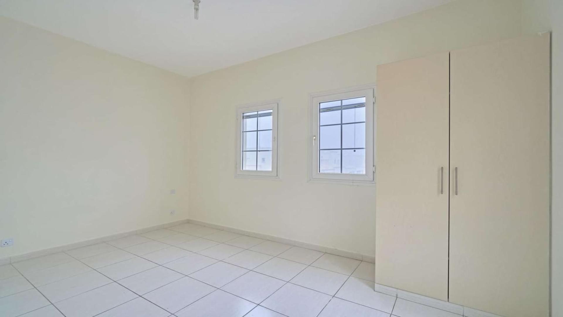 Empty bedroom with tiled floor and built-in wardrobe in Springs 14 townhouse for rent