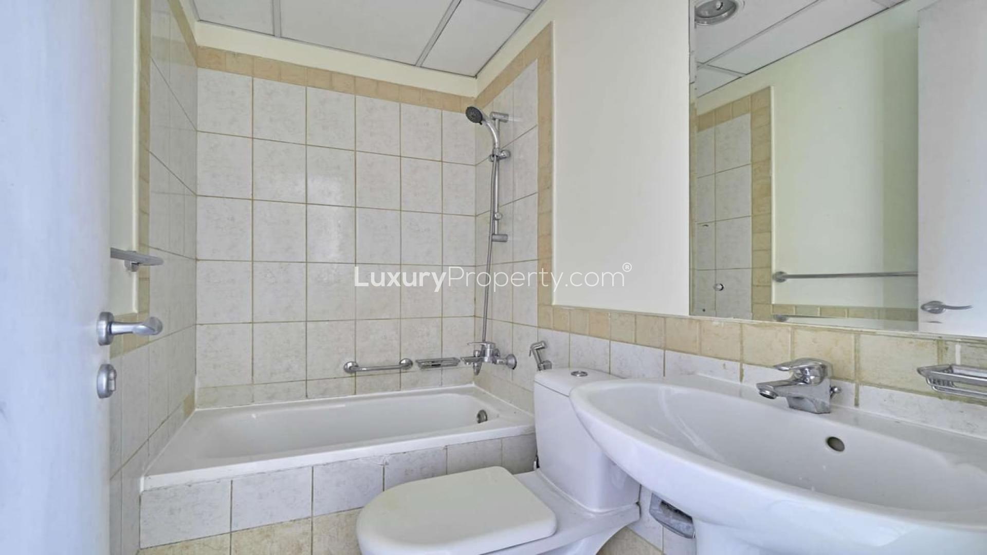 Bright empty room with tiled floor and garden view in Springs 7 villa for rent