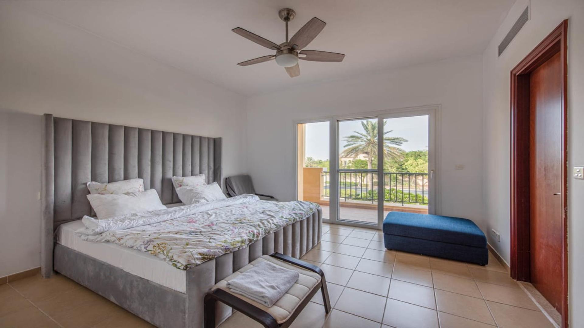 Living room in upgraded two-bedroom townhouse, Palmera, Arabian Ranches, with patio view