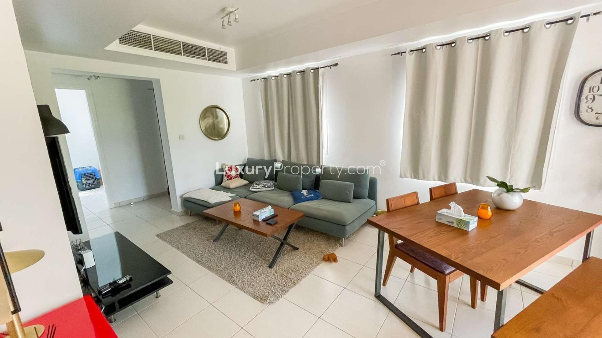 Bright living room in Springs 11 villa for rent, featuring modern decor and garden view