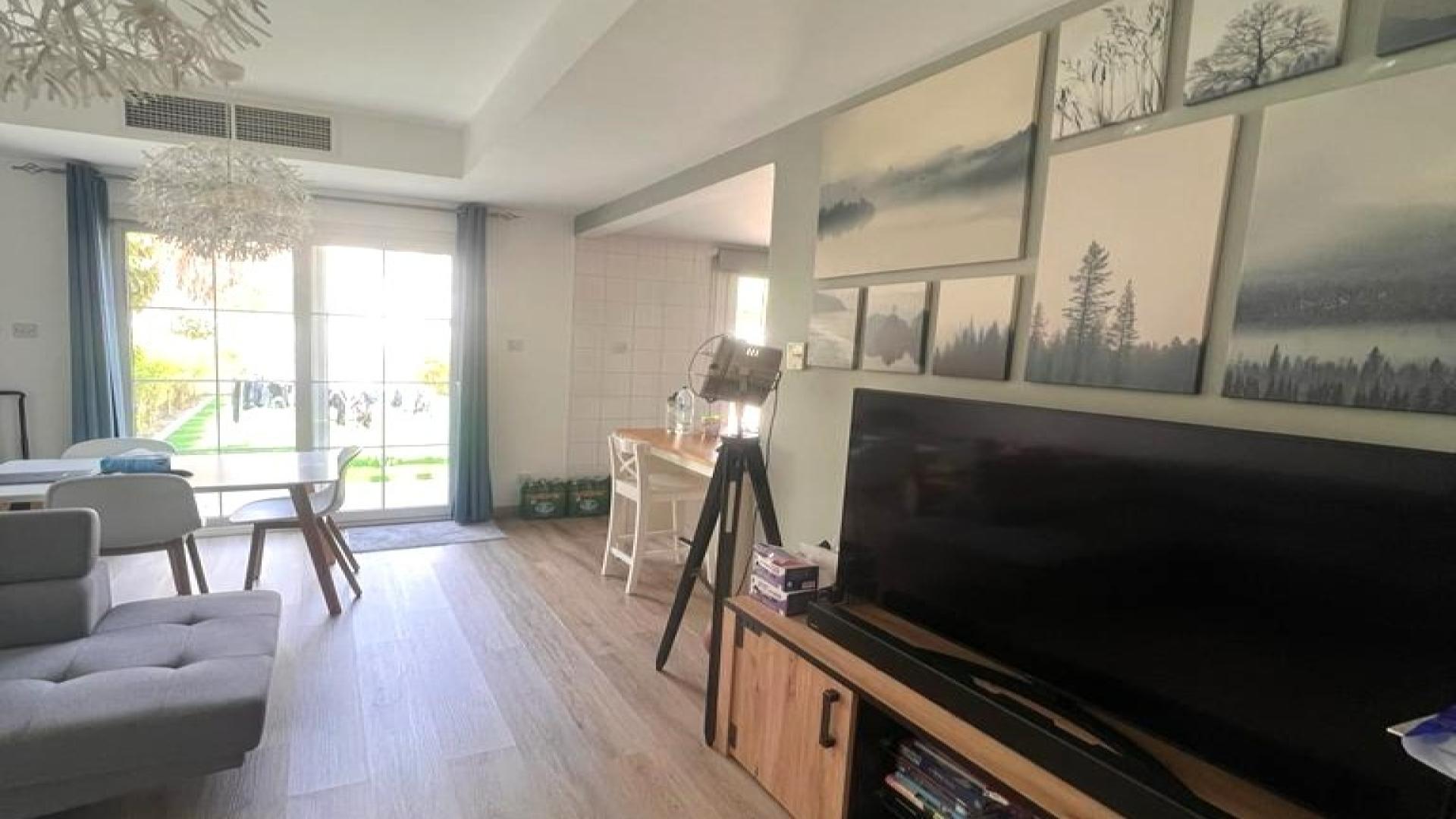 Spacious living room with modern decor in furnished Springs 7 villa for rent