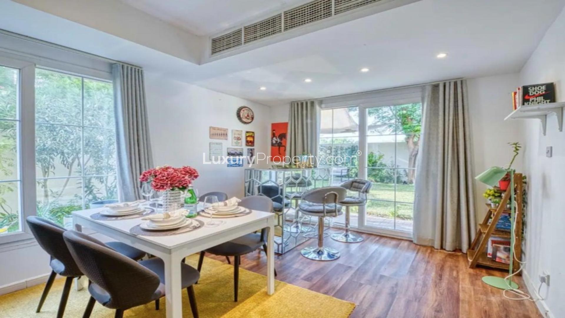 Charming living room in 2-bedroom villa, Springs 11, featuring modern decor and garden view