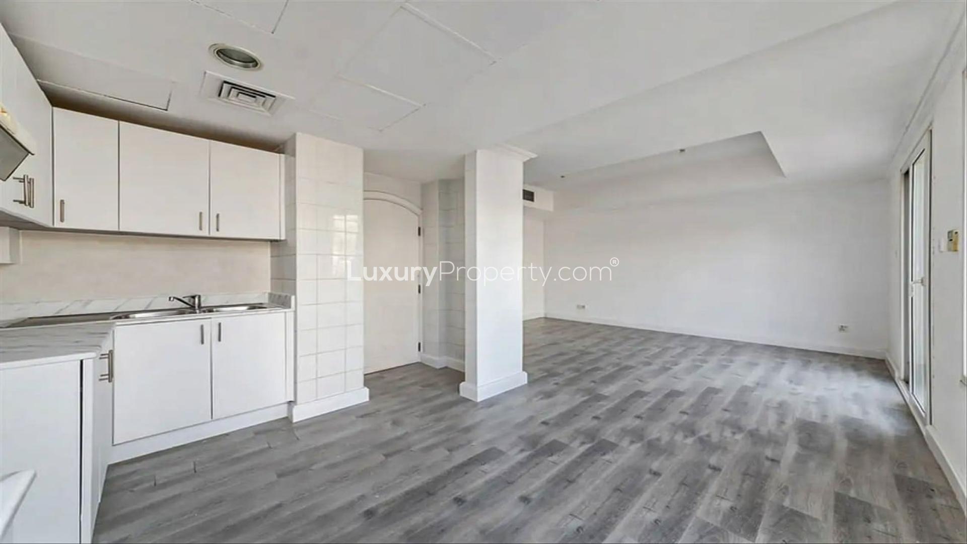 Spacious living area with modern flooring in upgraded Springs 4 villa, Dubai