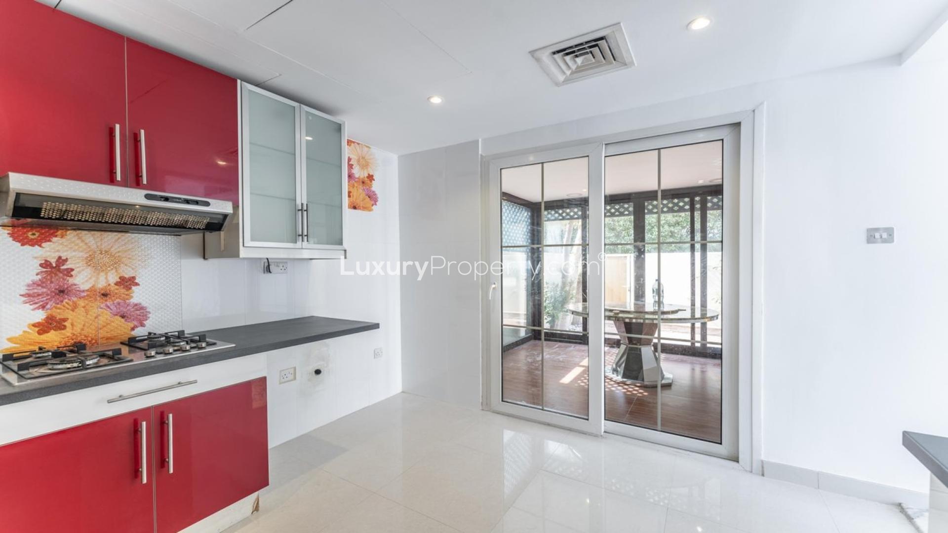 Modern kitchen with red cabinets in Springs 12 villa, LP41146, available for rent