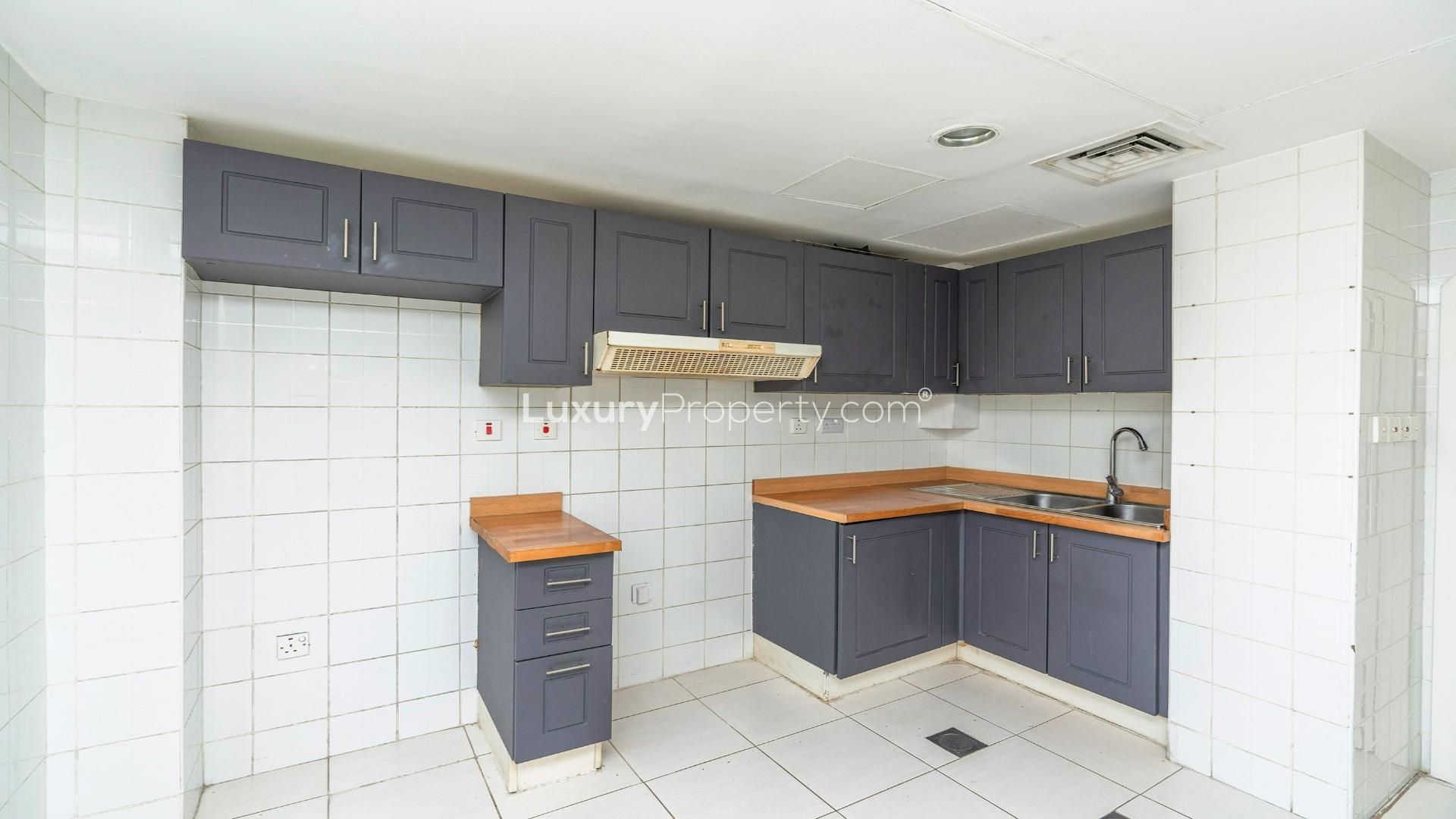 Modern kitchen and dining area in 2-bedroom villa, Springs 4, available for rent