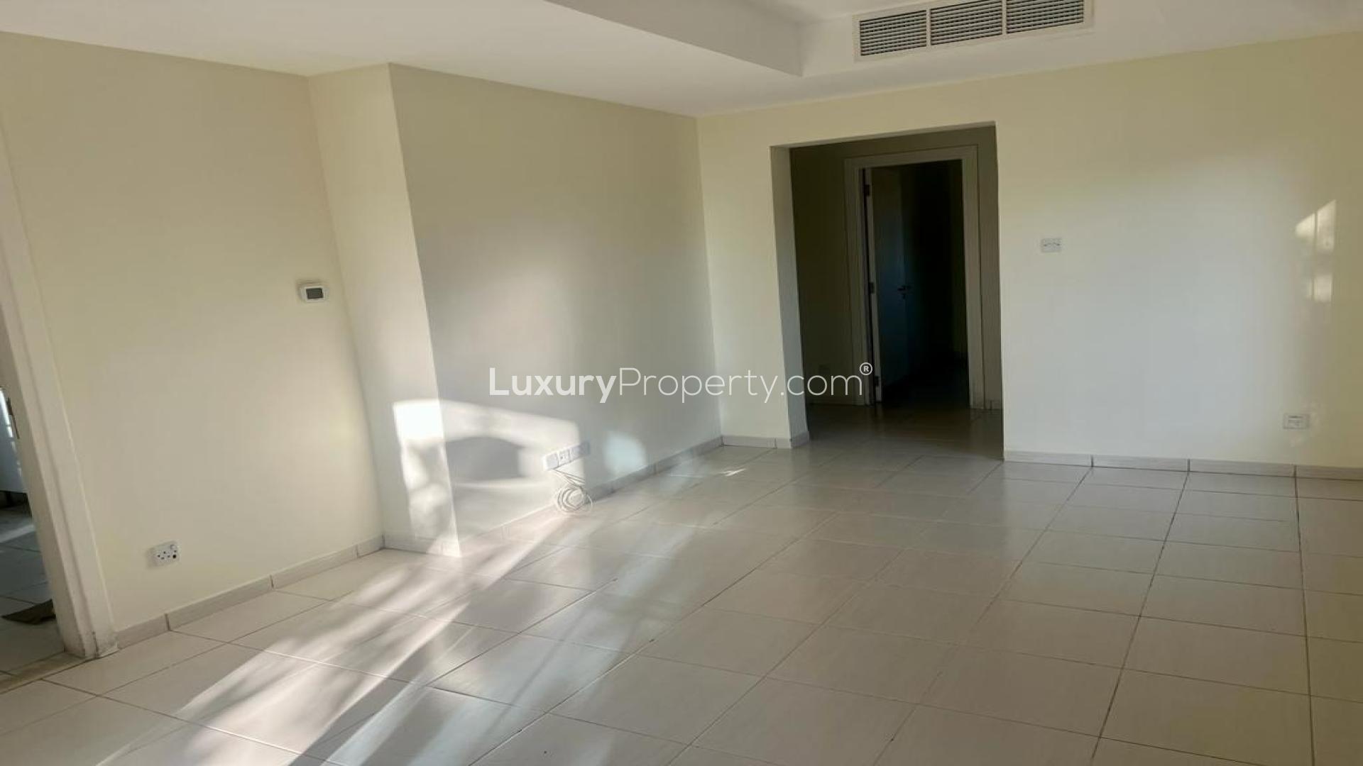 Modern kitchen in 2-bedroom villa for rent, Springs 7, featuring sleek white cabinets
