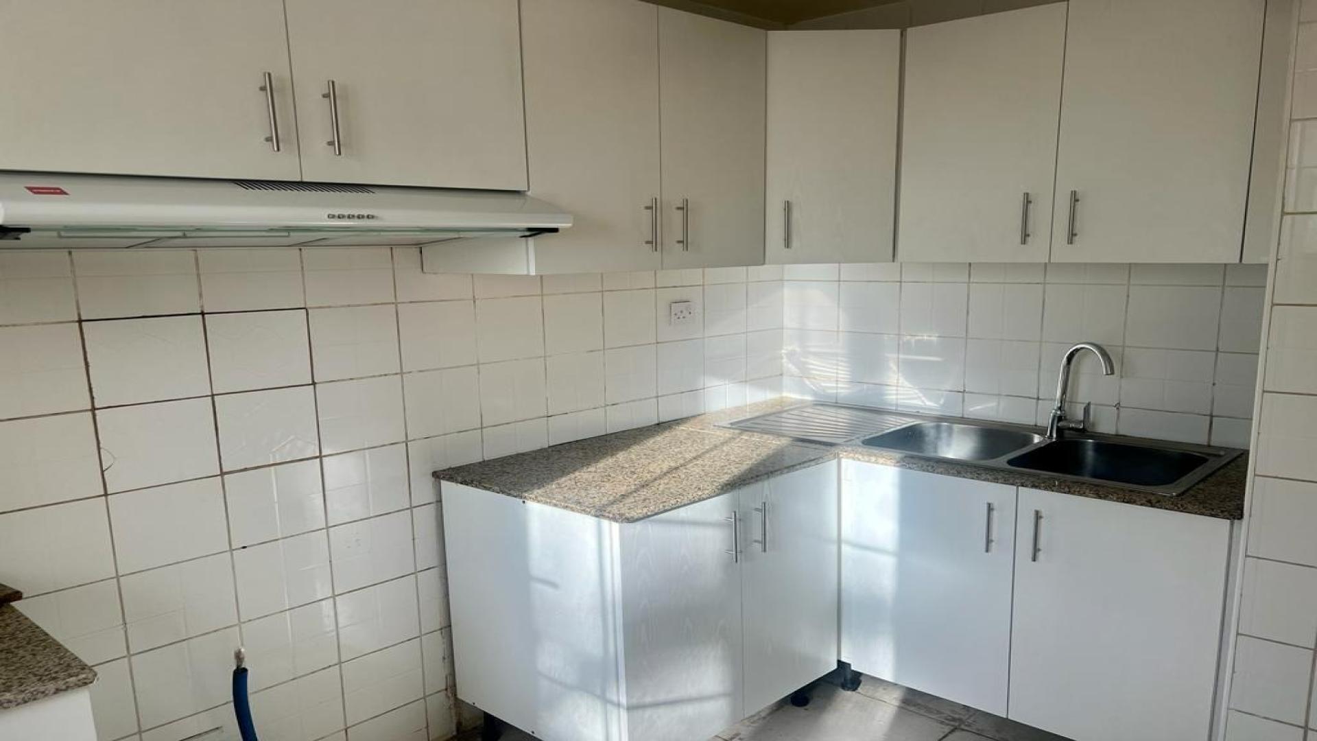 Bright living area with garden view in Springs 7 villa, spacious and modern design