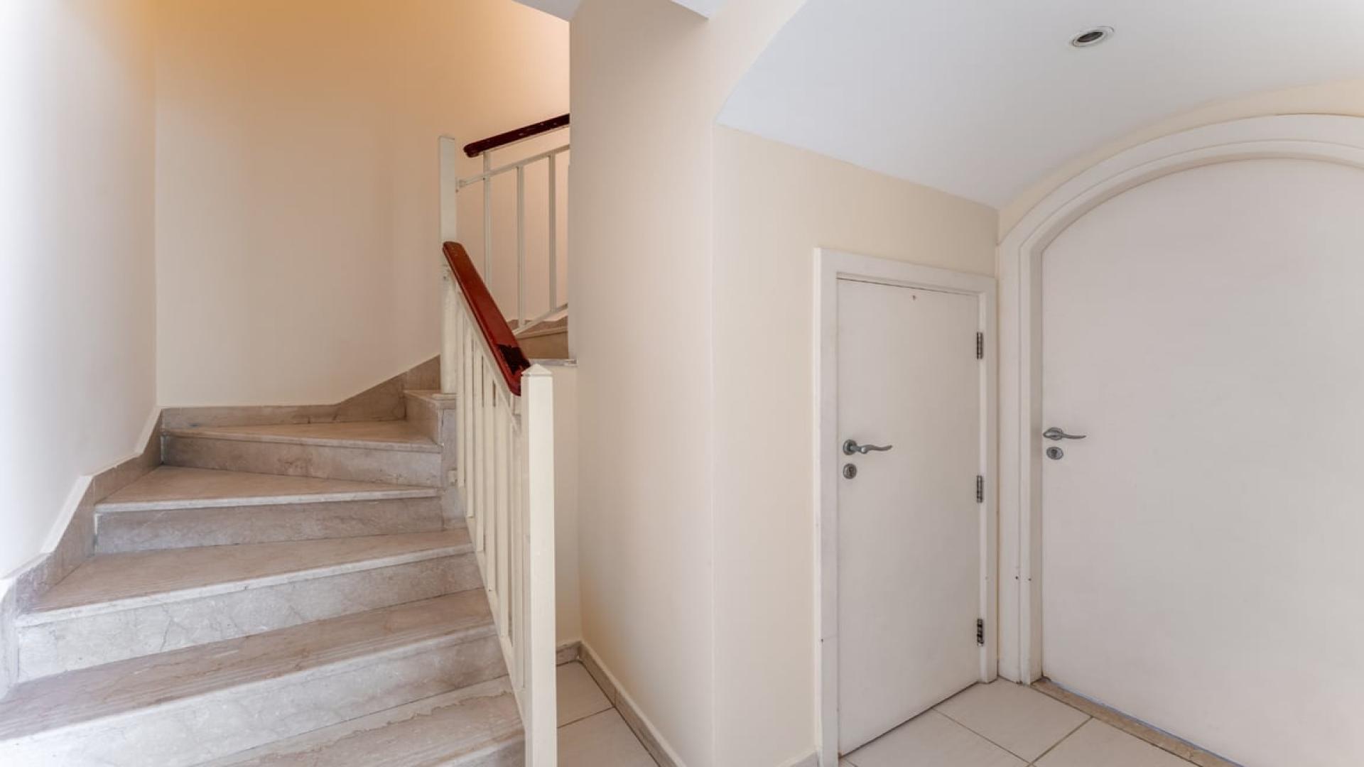 Kitchen with white cabinets in 2-bedroom villa, Springs 10, The Springs for rent