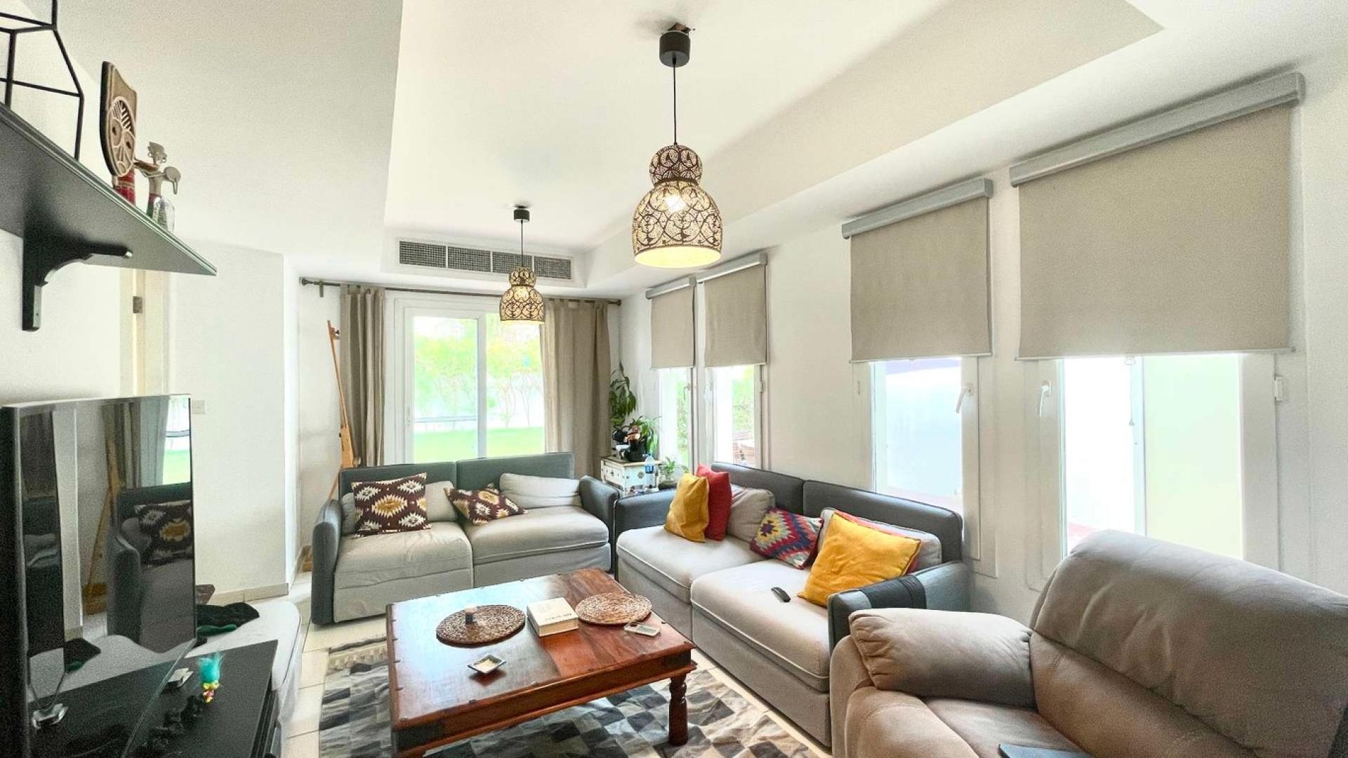 Beautiful garden and pool area in Springs 14 villa community, lush greenery and pathways