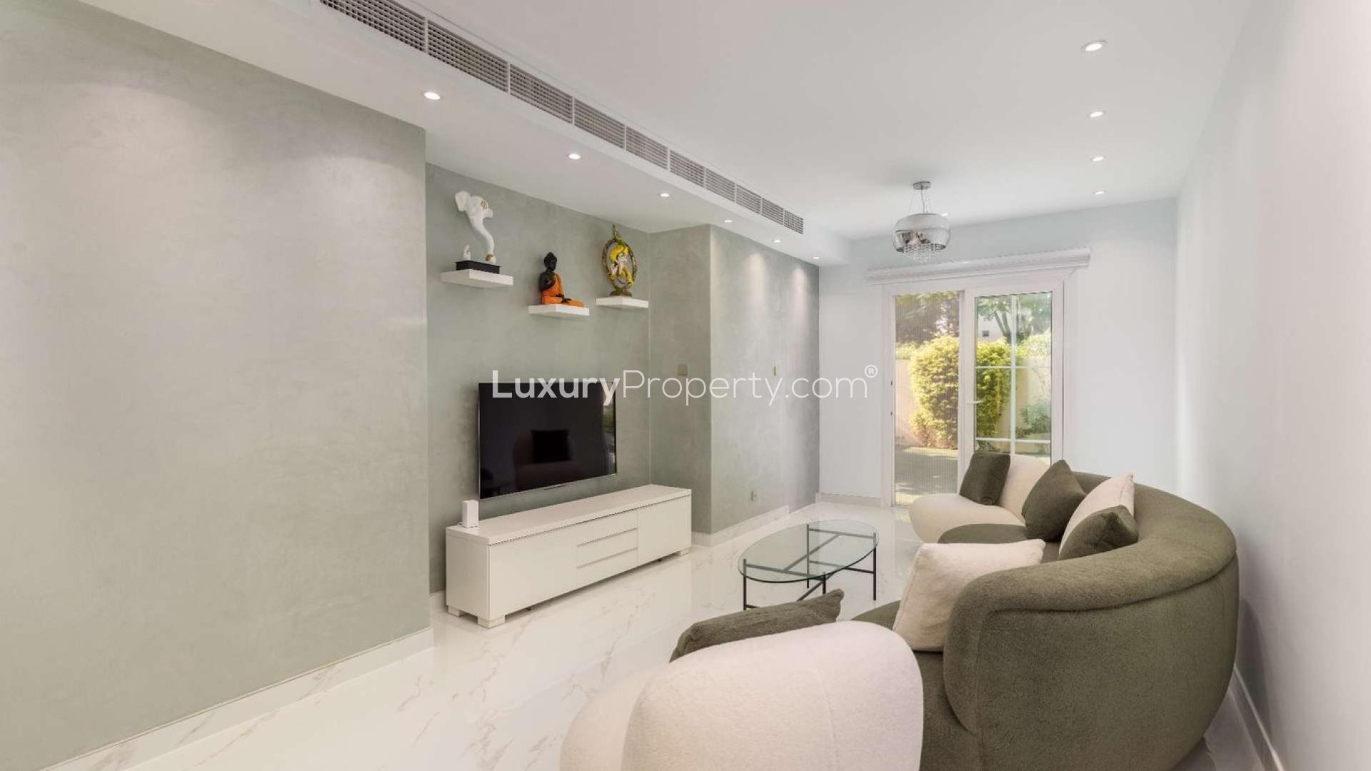 Modern living room in upgraded 2-bedroom villa, Springs 12, featuring stylish furniture and decor