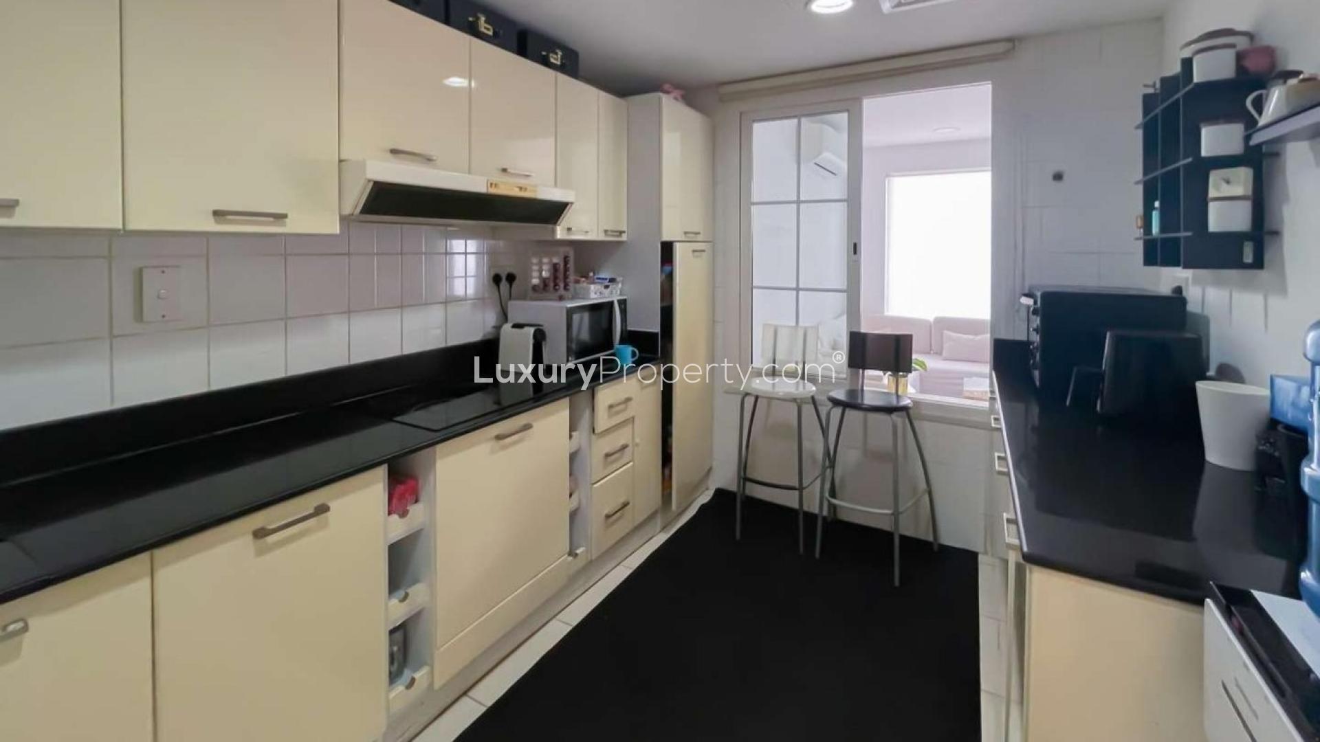 Upgraded villa garden with seating area in Springs 12, ideal for outdoor relaxation