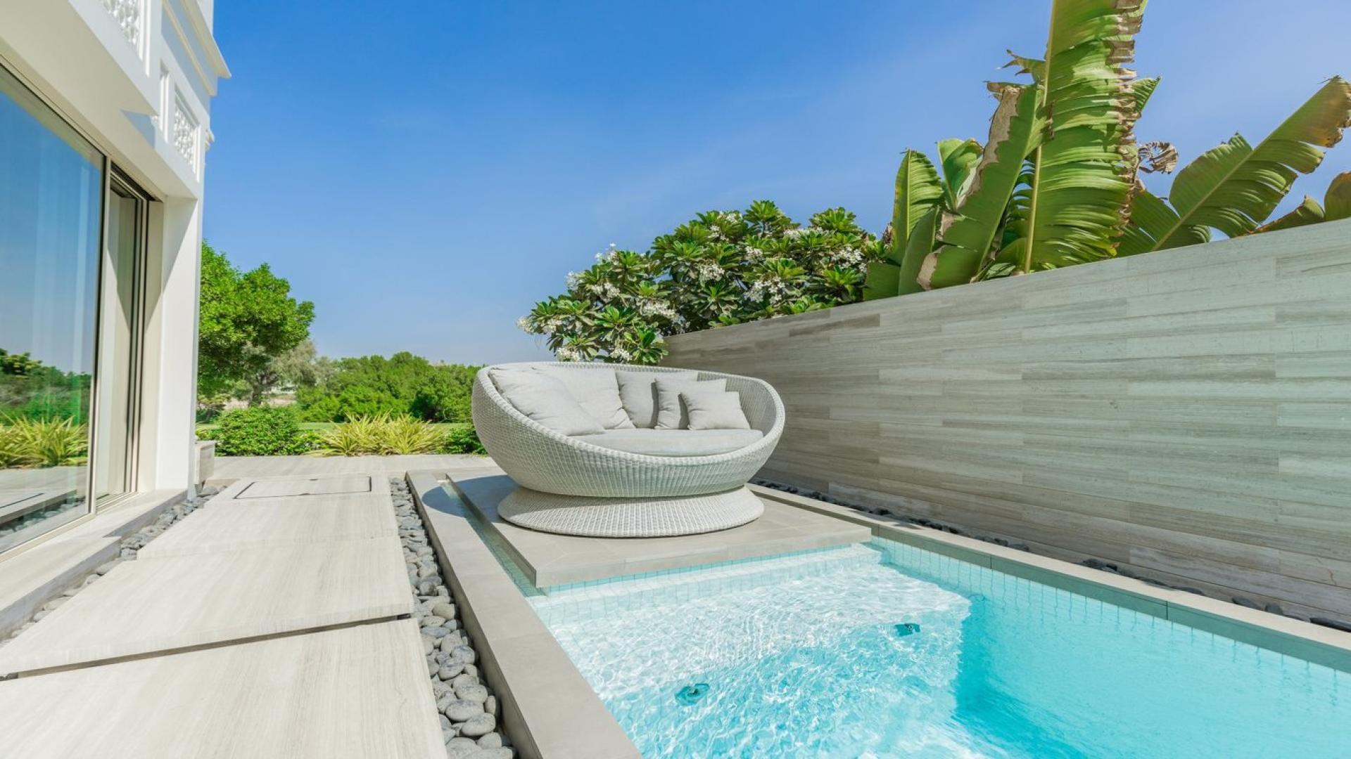 Luxury living room in 2-bedroom villa, Emirates Hills, overlooking golf course