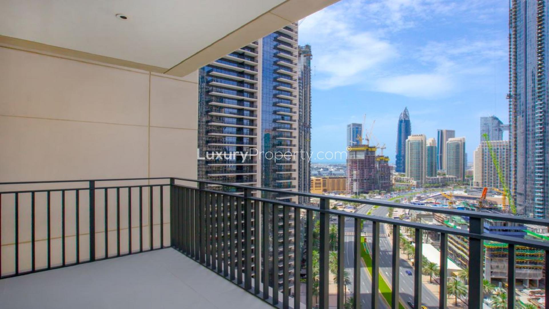 Spacious living room with large windows in Boulevard Crescent apartment, Downtown Dubai