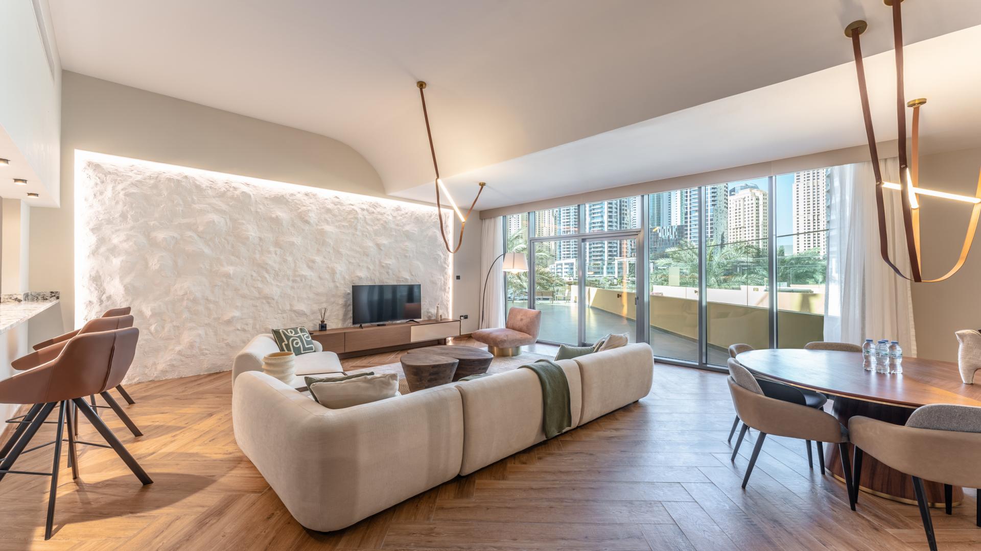 Modern living room in Dubai Marina Moon apartment with stylish decor and marina view