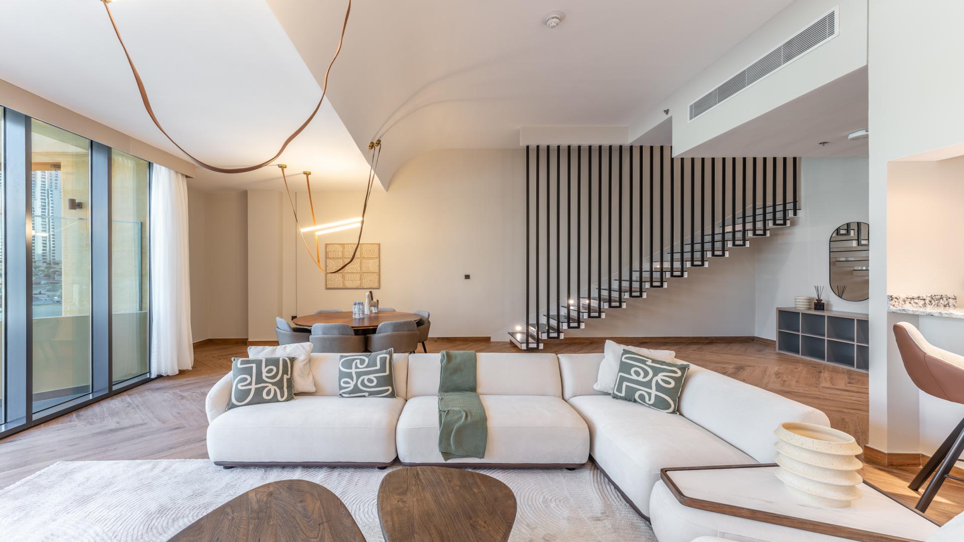 Modern living room in Dubai Marina Moon apartment with elegant furnishings and open layout