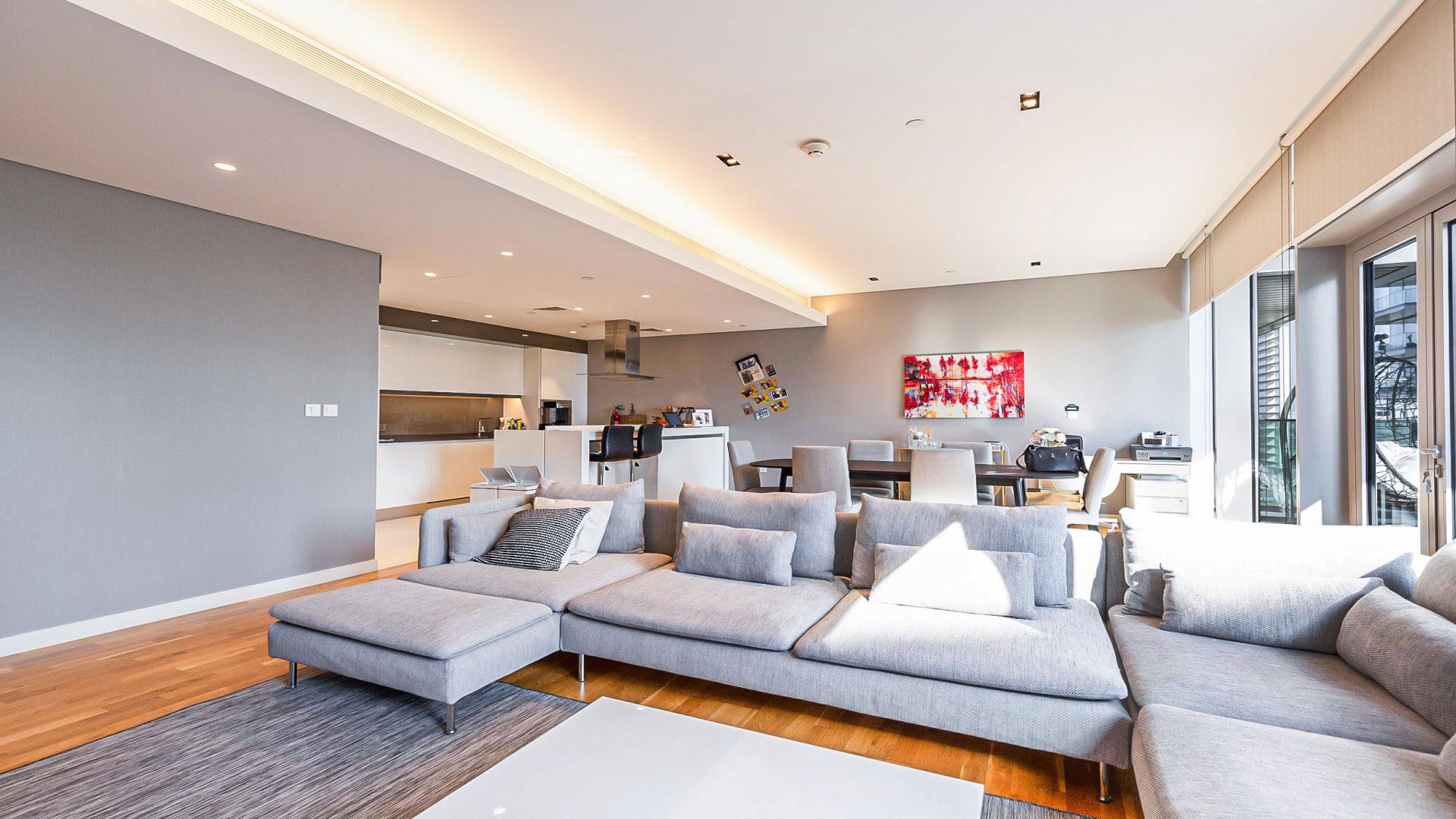 Exterior view of Bluewaters Residences apartment with lush greenery and modern architecture