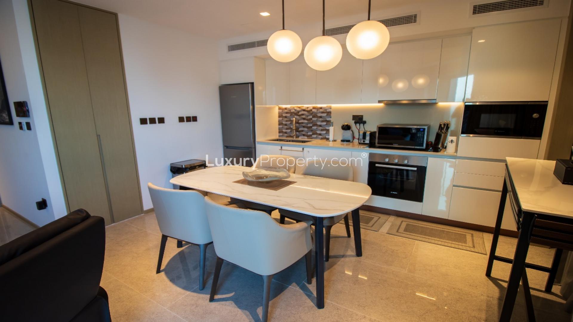 Modern kitchen and dining area in Dubai Creek Harbour apartment, Address Harbour Point