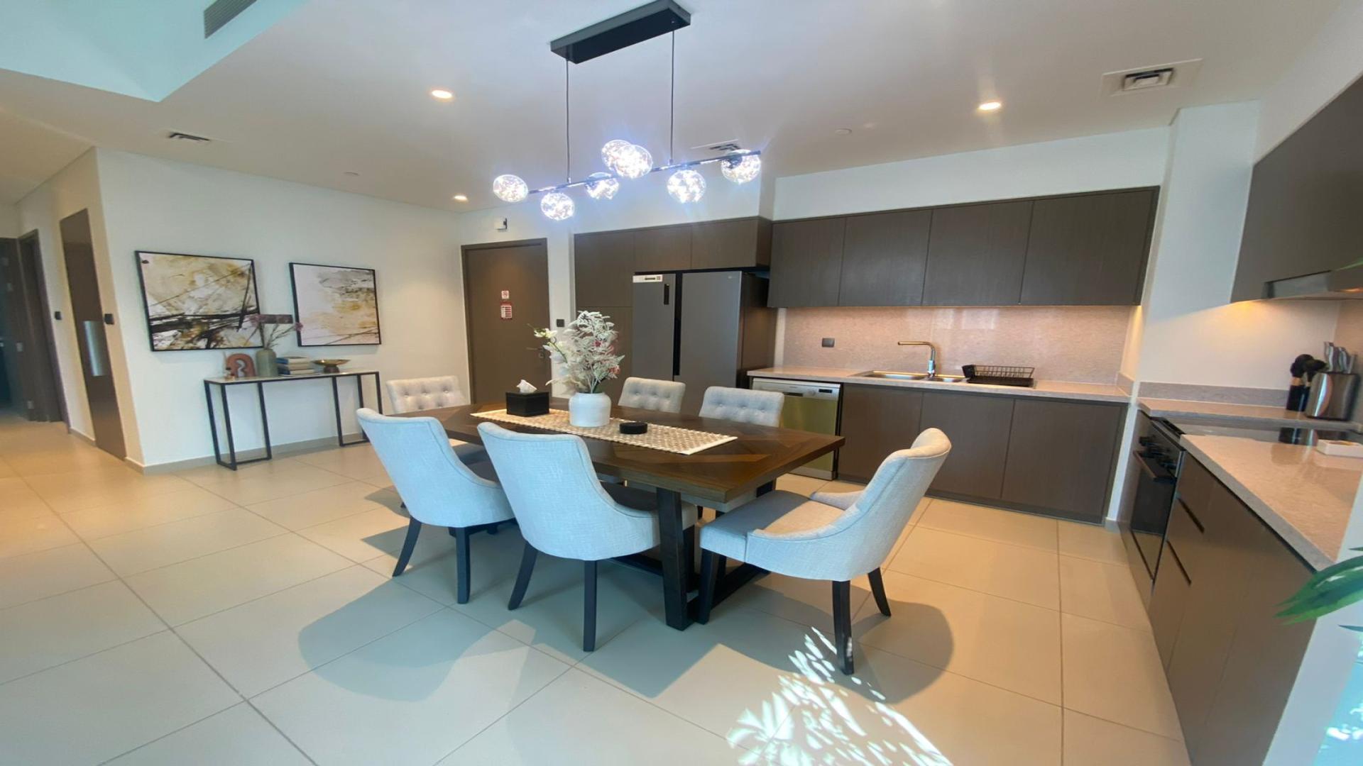 Fully furnished living room in 2-bedroom apartment, Opera District, Downtown Dubai, with balcony view