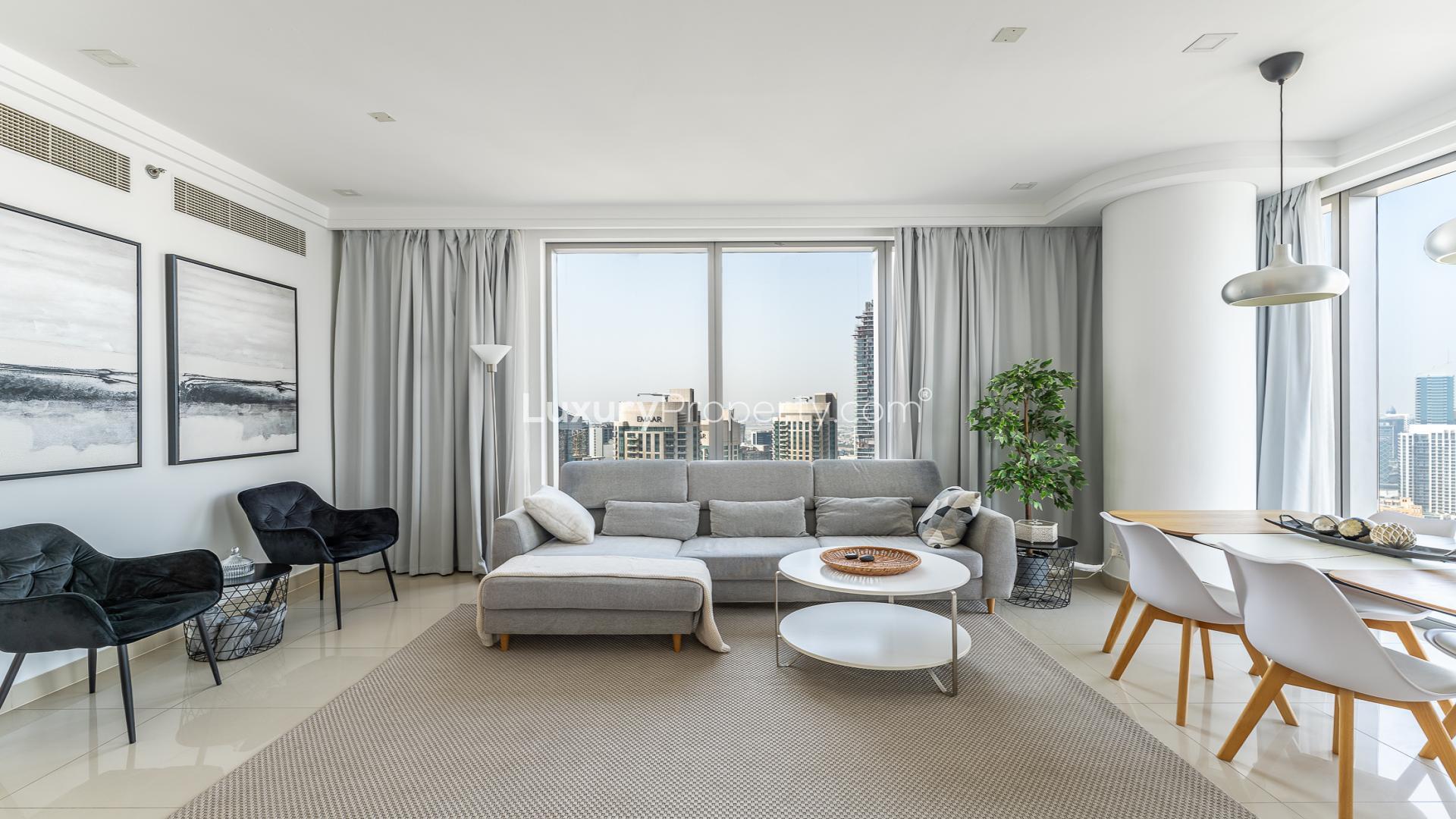 Fully furnished living room in Boulevard Point apartment, Downtown Dubai, with city skyline views