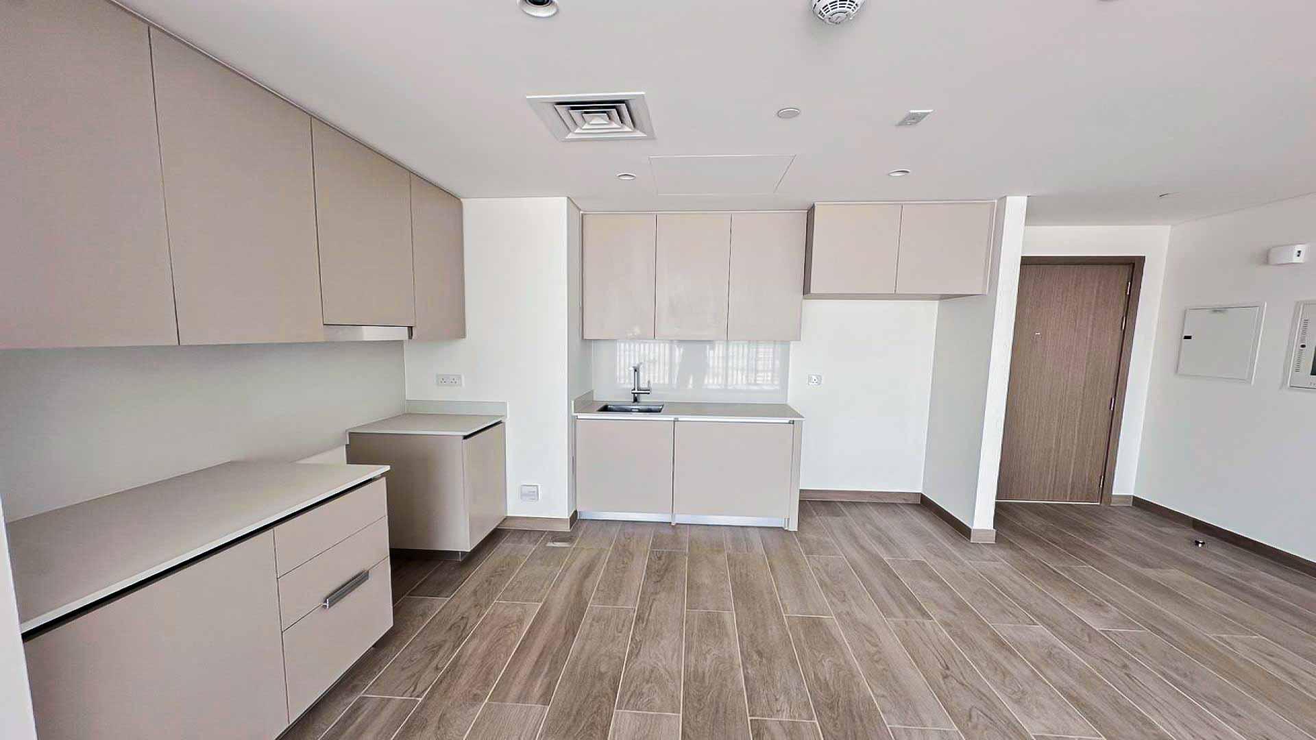 Spacious living area with large windows in Dubai Creek Harbour apartment for rent