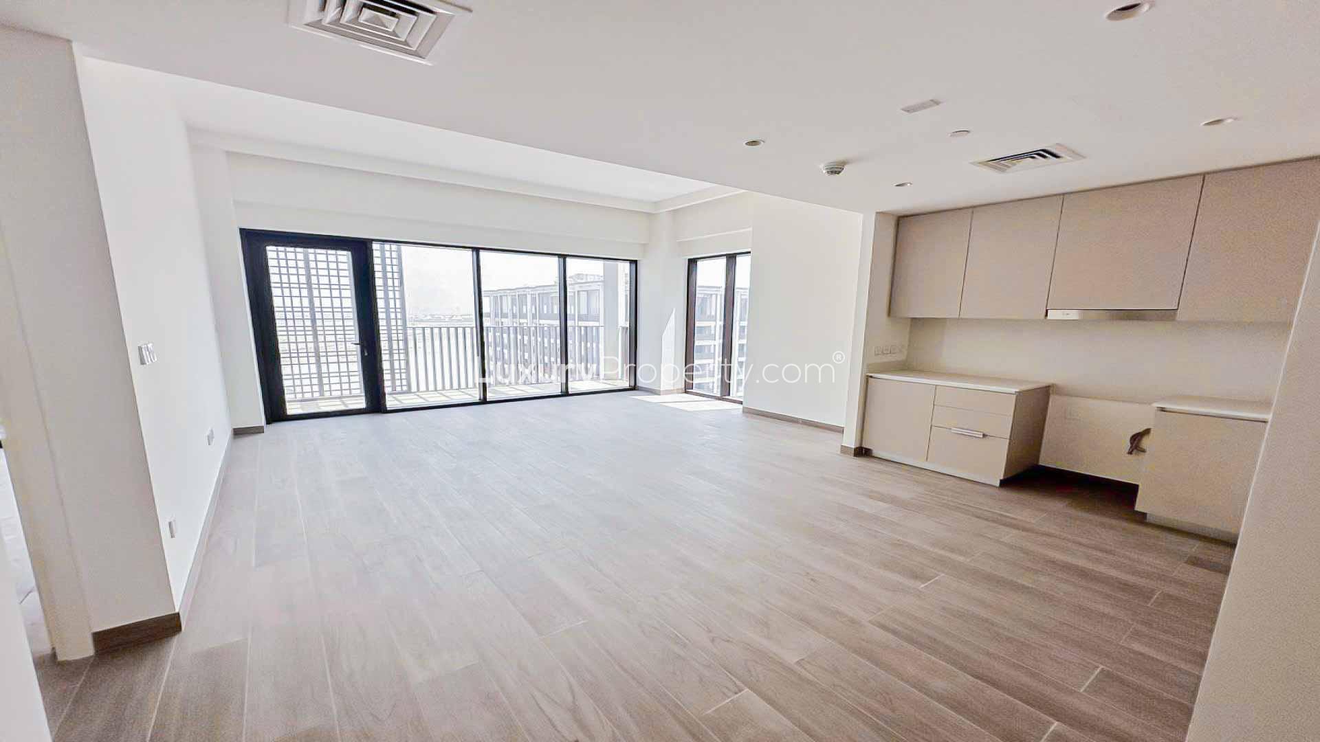 Spacious open-plan living area in Creek Beach apartment, Dubai Creek Harbour, with modern kitchen