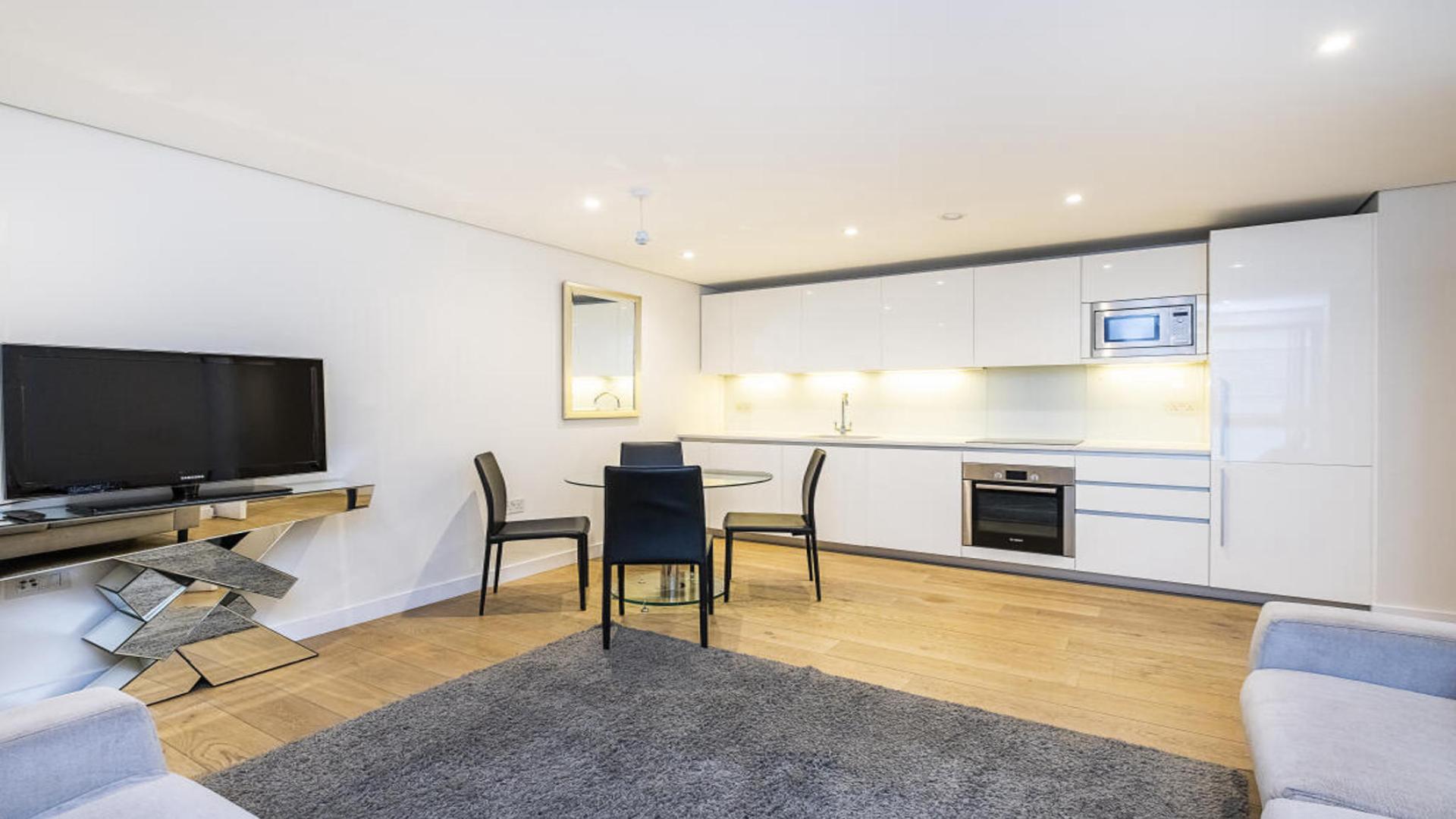 Modern living room and kitchen in two-bedroom apartment, 4 Merchant Square, London