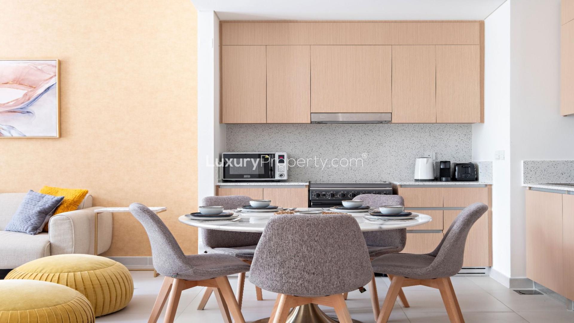 Modern living room in Dubai Creek Harbour apartment, featuring stylish decor and natural light